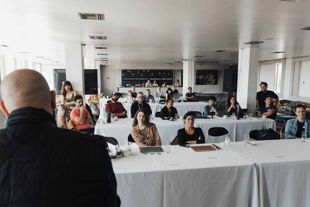 Attendees watching a presentation at a corporate event