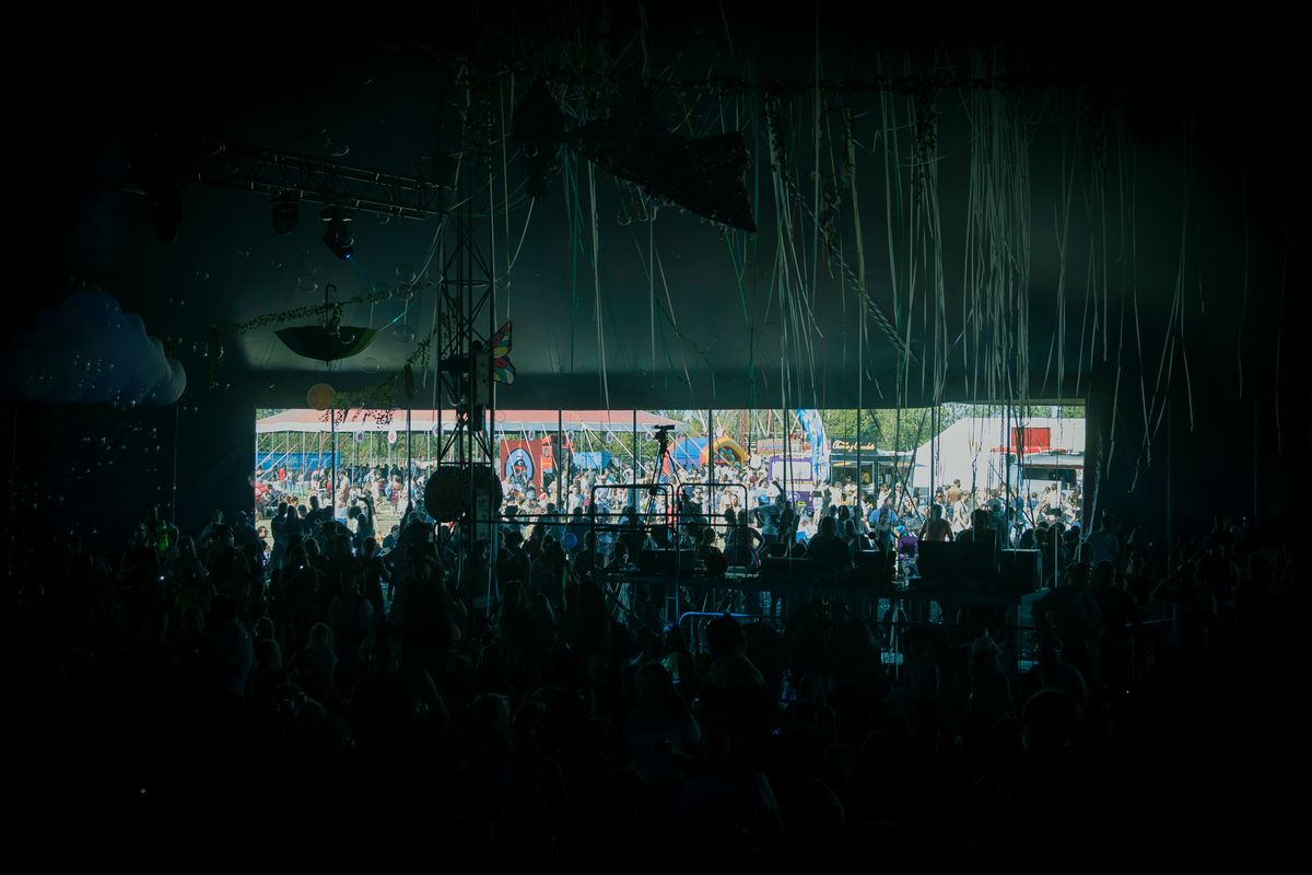 Crowd in front of a stage at a music festival