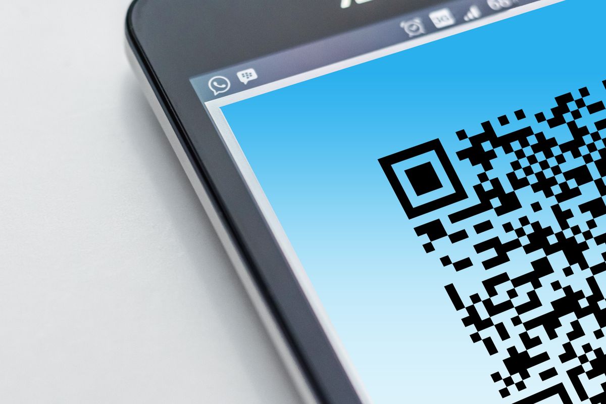 Smartphone displaying a QR code on its screen